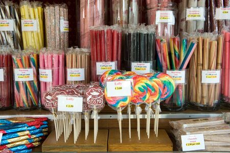 A lot of different acid grips and other sweets in a candy storeの写真素材
