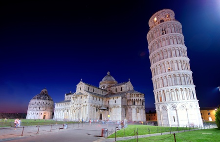 The hanging tower of Pisa and cathedral after sunsetの写真素材