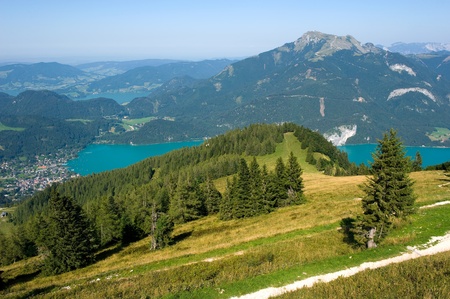 View from the zwolferhorn mountain on to the Wolfgangsee in Austria, the schafberg on the other side of the lakeの写真素材