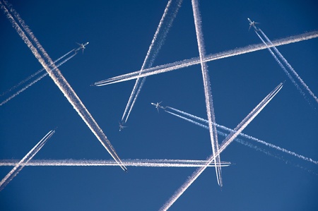 More and more airplanes are flying in the airの写真素材
