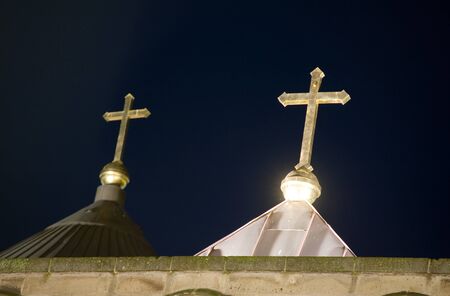 Two crosses on the roof of a church in the evening light in the Netherlandsの写真素材