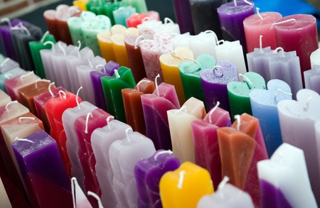 Lot of different colored candles in a rowの写真素材