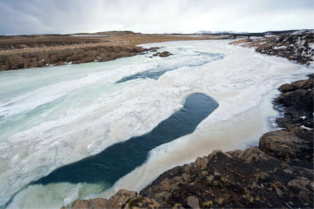 A wild river with a lot of ice in Iceland in the winter