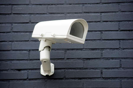 Security camera on the wall of a building