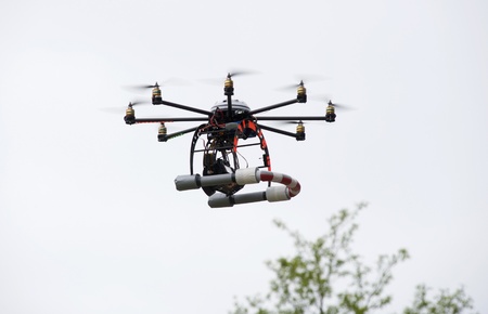 An octocopter with camera flyingの写真素材