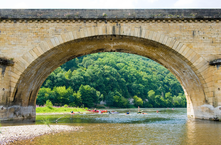 Arch of the bridge of Grolejac over the river Dordogne in Franceの写真素材