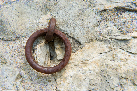 Old rusty ring in a wall in franceの写真素材