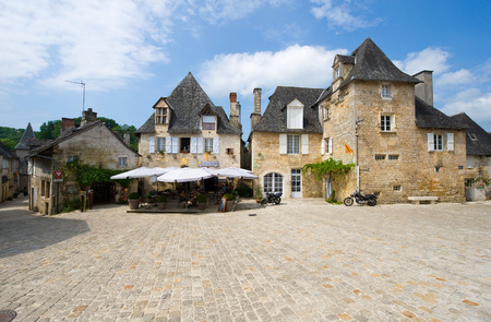 TURENNE, FRANCE - JULY 23  Old picturesque buildings in the center of the romantique village of Turenne in the district Dordogne in France, July 23, 2014 in Franceのeditorial素材
