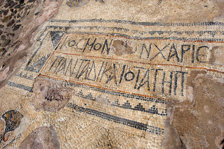 Roman characters written on a floor between ruins in Beit Sheの写真素材