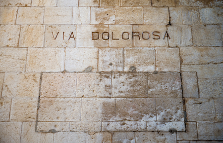 Via Dolorosa written on a wall in the old city of Jerusalemのeditorial素材