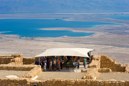 MASADA, ISRAEL - OCT 14, 2014: Tourists on top of the rock Masada in Israelのeditorial素材