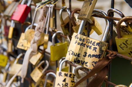 PARIS, FRANCE - JULY 28, 2015: Thousands of padlocks on a fence near the Pont des Arts symbolize 'love forever' in Paris in Franceのeditorial素材