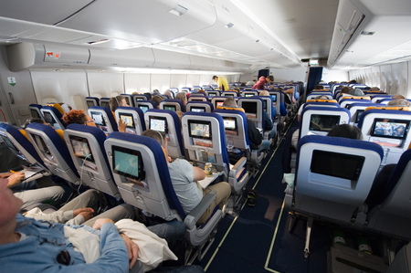 MIAMI, UNITED STATES OF AMERICA - 25 APRIL, 2016: Interior of an airplane on an intercontinental flight to Americaのeditorial素材