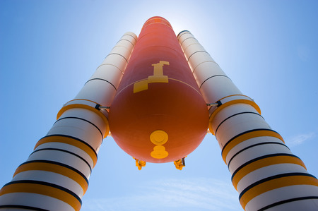 KENNEDY SPACE CENTER, FLORIDA, USA - APRIL 27, 2016: Boosters and fuel tank in front of the the entrance of the building where Space Shuttle Atlantis is exhibited at the visitor complex of Kennedy Space Centerのeditorial素材