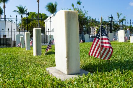 KEY WEST, FLORIDA, USA - MAY 02, 2016: American flags on graves at the battleship Maine memorial section at the Key West cemetery.のeditorial素材