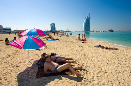 DUBAI, UNITED ARAB EMIRATES - JAN 02, 2018: Public beach of Dubai near the Burj Al Arab hotel.のeditorial素材