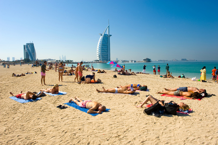 DUBAI, UNITED ARAB EMIRATES - JAN 02, 2018: Public beach of Dubai near the Burj Al Arab hotel.のeditorial素材
