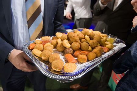 Several greasy snacks served on a plateの写真素材