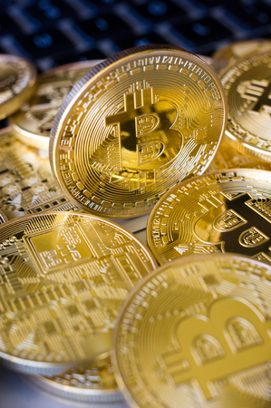 Bitcoins on the keyboard of a laptop