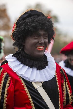 ENSCHEDE, THE NETHERLANDS - NOV 16, 2019: Black pete is the helping hand of the Dutch Santa Claus called Sinterklaas.のeditorial素材