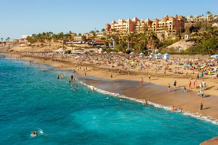CANARY ISLAND TENERIFE, SPAIN - DEC 27, 2019: Tourits on Playa El Duque. It? one of the most popular beaches on Tenerife.のeditorial素材
