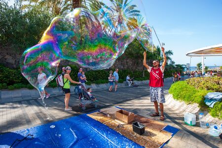 CANARY ISLAND TENERIFE, SPAIN - DEC 27, 2019: A bubble artist on Plaza Duque. It ?? sa boulevard...