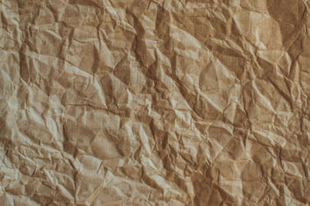Textured crumpled Kraft paper. Brown texture.の写真素材