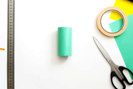 Step-by-step lesson: how to make a cute cactus from a toilet sleeve and colored paper. Using scissors and glue. Step 4. Interesting crafts with children.の写真素材