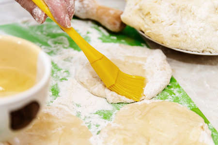 Cooking from dough. Grease the dough with a silicone brush oil. Making pies at home