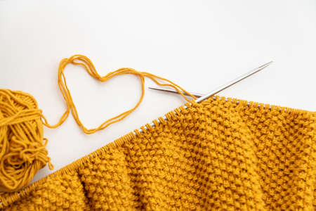 Knitting wool and knitting needles on light background. selective focusの写真素材