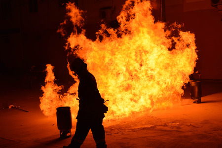 Man in fire show after Firefighters training, Rehearse of firefighters from cooking. The burning gas...