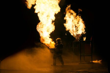 Man in fire show after Firefighters training, Rehearse of firefighters from gas tank.