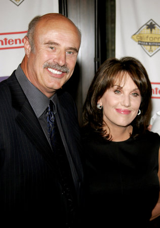 Dr. Phil McGraw and wife Robin McGraw attend the 2007 Starlight Starbright Children Foundation Gala held at the Beverly Hilton Hotel in Beverly Hills, California on March 23, 2007.のeditorial素材