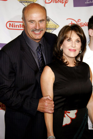 Dr. Phil McGraw and wife Robin McGraw attend the 2007 Starlight Starbright Children Foundation Gala held at the Beverly Hilton Hotel in Beverly Hills, California on March 23, 2007.のeditorial素材