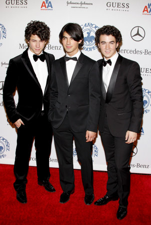 BEVERLY HILLS, CA - OCTOBER 25, 2008: Kevin Jonas, Joe Jonas and Nick Jonas of Jonas Brothers at the 30th Anniversary Carousel Of Hope Ball held at the Beverly Hilton Hotel in Beverly Hills, USA on October 25, 2008.のeditorial素材