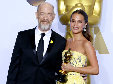 Alicia Vikander and J.K. Simmons at the 88th Annual Academy Awards - Press Room held at the Loews Hollywood Hotel in Hollywood, USA on February 28, 2016.のeditorial素材