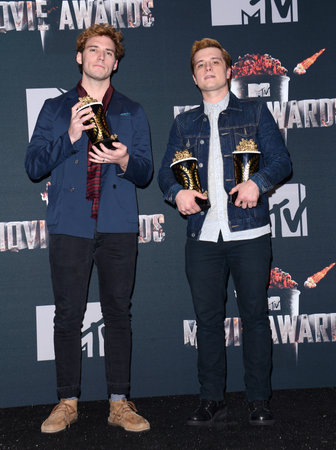 Josh Hutcherson and Sam Claflin at the 2014 MTV Movie Awards - Press Room held at the Nokia Theatre L.A. Live in Los Angeles, USA on April 13, 2014.のeditorial素材