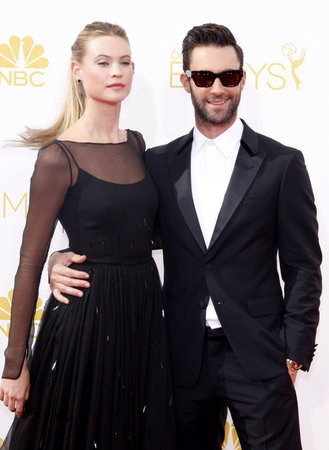 LOS ANGELES, CA - AUGUST 25, 2014: Behati Prinsloo and Adam Levine at the 66th Annual Primetime Emmy Awards held at the Nokia Theatre L.A. Live in Los Angeles, USA on August 25, 2014.のeditorial素材