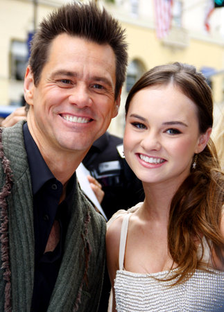 Jim Carrey and Madeline Carroll at the Los Angeles premiere of 'Mr. Popper's Penguins' held at the Grauman's Chinese Theatre in Hollywood, USA on June 12, 2011.のeditorial素材