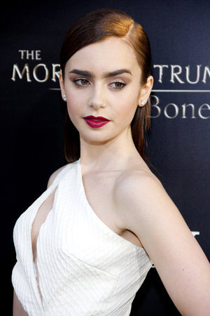 Lily Collins at the Los Angeles premiere of 'The Mortal Instruments: City Of Bones' held at the Cinerama Dome in Hollywood, USA on August 12, 2013.のeditorial素材