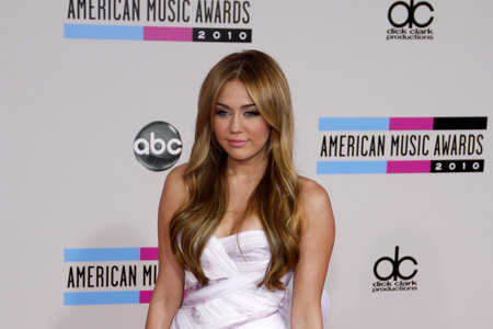 Miley Cyrus at the 2010 American Music Awards held at the Nokia Theatre L.A. Live in Los Angeles, USA on November 21, 2010.のeditorial素材