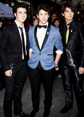 Kevin Jonas, Joe Jonas and Nick Jonas at the World premiere of 'Jonas Brothers: The 3D Concert Experience' held at the El Capitan Theater in Hollywood, USA on February 24, 2009.のeditorial素材