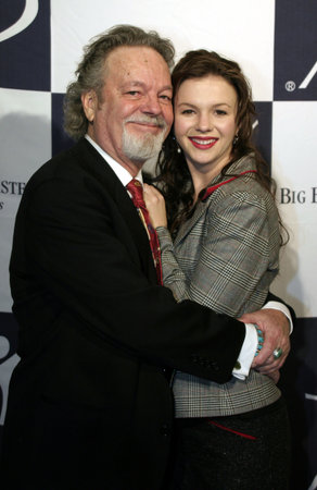 Amber Tamblyn and her father Russ at the Big Brothers Big Sisters of greater Los Angeles & the Inland Empire to honor top entertainment industry talent at 'Rising Stars' 2004 Gala at the Beverly Hilton Hotel in Beverly Hills, USA on November 11, 2004.のeditorial素材