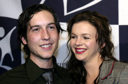 Chris Marquette and Amber Tamblyn at the Big Brothers Big Sisters of greater Los Angeles & the Inland Empire to honor top entertainment industry talent at 'Rising Stars' 2004 Gala at the Beverly Hilton Hotel, USA on November 11, 2004.のeditorial素材