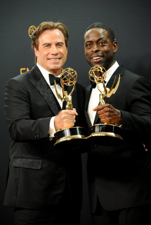 John Travolta and Sterling K. Brown at the 68th Annual Primetime Emmy Awards - Press Room held at the Microsoft Theater in Los Angeles, USA on September 18, 2016.のeditorial素材