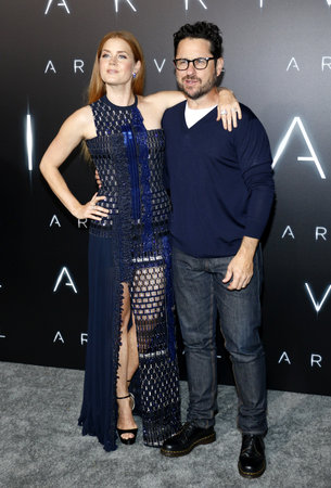 J.J. Abrams and Amy Adams at the Los Angeles premiere of 'Arrival' held at the Regency Village Theater in Westwood, USA on November 6, 2016.のeditorial素材