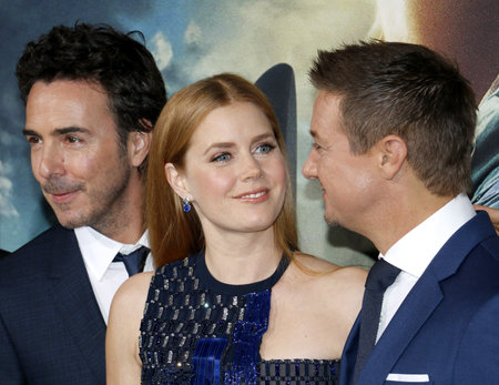 Shawn Levy, Jeremy Renner and Amy Adams at the Los Angeles premiere of 'Arrival' held at the Regency Village Theater in Westwood, USA on November 6, 2016.のeditorial素材