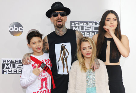 Landon Asher Barker, Travis Barker, Alabama Luella Barker and Atiana de la Hoya at the 2016 American Music Awards held at the Microsoft Theater in Los Angeles, USA on November 20, 2016.のeditorial素材