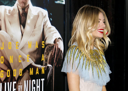 Sienna Miller at the Los Angeles premiere of 'Live By Night' held at the TCL Chinese Theatre in Hollywood, USA on January 9, 2017.のeditorial素材