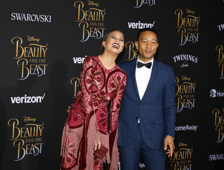 John Legend and Chrissy Teigen at the Los Angeles premiere of 'Beauty And The Beast' held at the El Capitan Theatre in Hollywood, USA on March 2, 2017.のeditorial素材